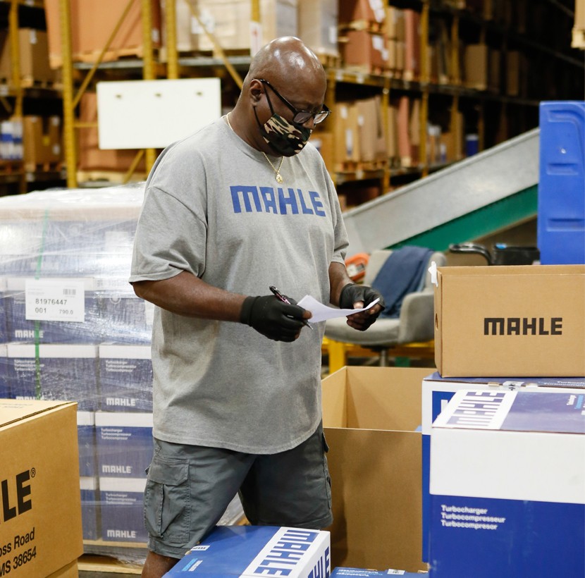 Supervisor reviewing orders at the MAHLE Aftermarket facility in Olive Branch. This man is a gasket supervisor. 