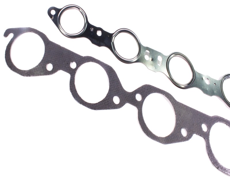 A MLS header gasket and a Graphite header gasket. The MLS header gasket is manufactured with 301 stainless steel to avoid burn through or blow out and the graphite header gasket is mechanically clinched on both sides to withstand and transfer extreme heat. 