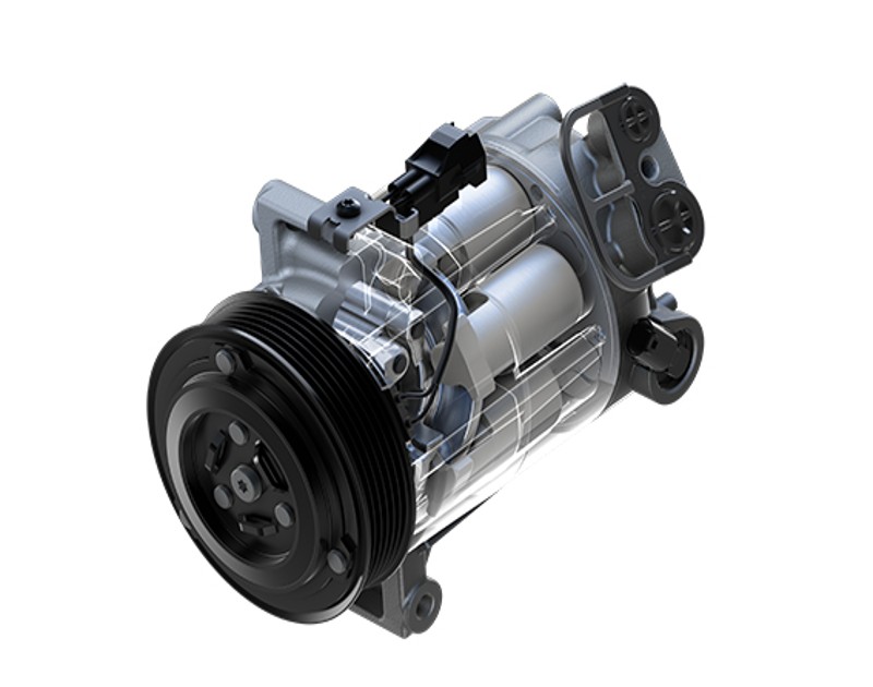 MAHLE A/C compressor with parts spread out to show the different components of the A/C compressor. 